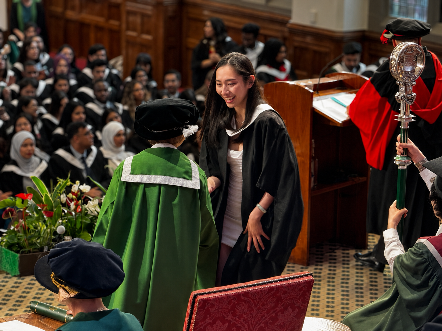 A graduate in Leeds being congratulated during a ceremony